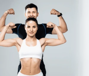 beautiful athletic couple show biceps - mobile trainers
